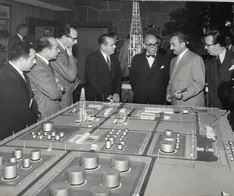 President Celal Bayar being presented with a model of Turkey's first refinery in Batman, built by Ahmet Halim Neyzi
